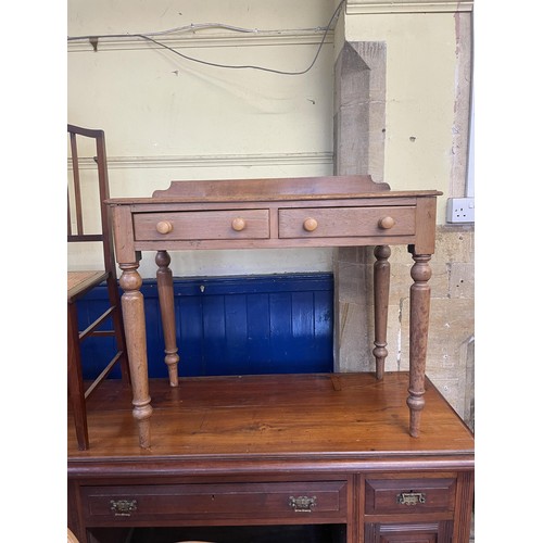 1301 - A mahogany side table, 19 cm wide, a walnut sideboard, lacking base and top, a pine table and four c... 