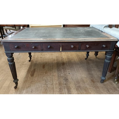 1319 - A 19th century mahogany library table, having three drawers, on tapering reeded legs, 135 cm wide