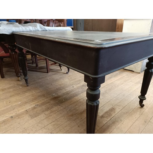 1319 - A 19th century mahogany library table, having three drawers, on tapering reeded legs, 135 cm wide