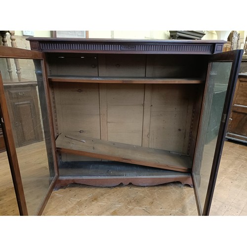 1337 - A mahogany bookcase, with two glazed doors, 123 cm high x 135 wide