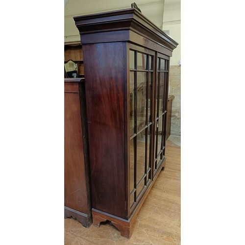 1338 - A mahogany bookcase, with two glazed doors, 160 cm high x 134 cm wide, and an oak pantry cupboard 74... 