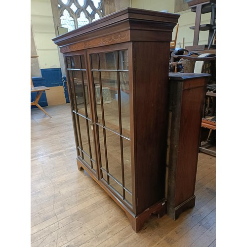 1338 - A mahogany bookcase, with two glazed doors, 160 cm high x 134 cm wide, and an oak pantry cupboard 74... 