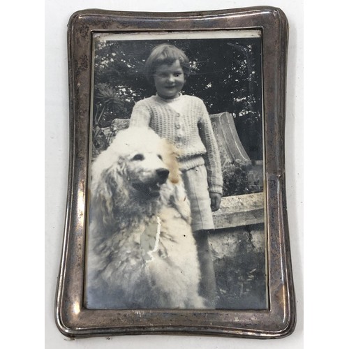 445 - A George V silver mounted photograph frame, and three others (4)