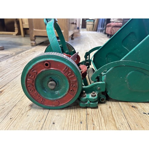 1261 - A Ransomes painted garden push along mower and grass box