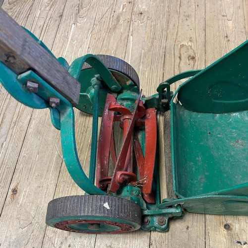 1261 - A Ransomes painted garden push along mower and grass box