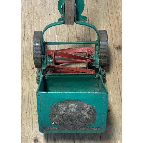 1261 - A Ransomes painted garden push along mower and grass box