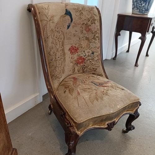 1294 - An early Victorian rosewood chair, with a needlework back and seat