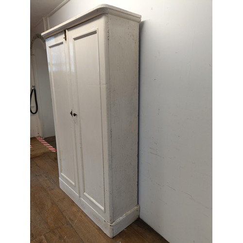 1292 - A kitchen table, with a later formica top, 137 cm wide, and a painted pine cupboard (2)