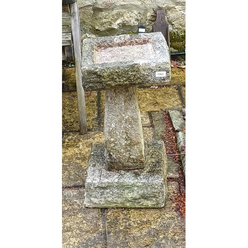 1363 - A composite stone bird bath, 63 cm high