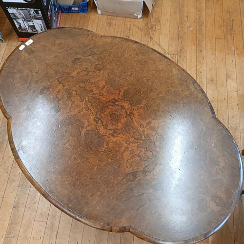 1312 - A 19th century loo table, veneered in burr walnut, 130 cm wide