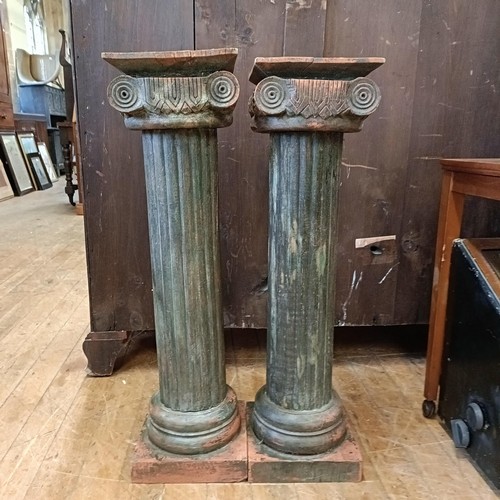 1310 - A pair of painted Ionic style columns, 76 cm high