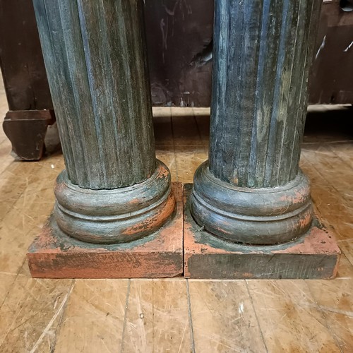 1310 - A pair of painted Ionic style columns, 76 cm high