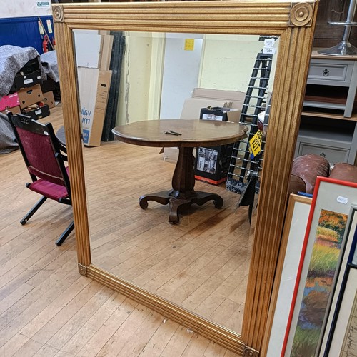 1309 - A gilt framed wall mirror, 141 x 110 cm