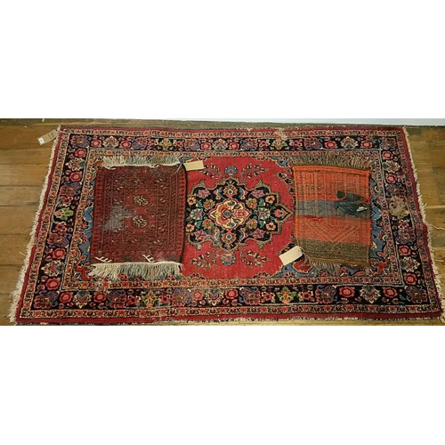 1245 - A red ground rug, 210 x 116 cm, a prayer mat, 61 x 52 cm, and another, 61 x 44 cm (3)