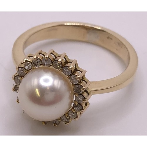 820 - A yellow coloured metal, cultured pearl and diamond chip cluster ring, ring size L