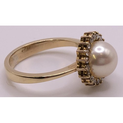 820 - A yellow coloured metal, cultured pearl and diamond chip cluster ring, ring size L