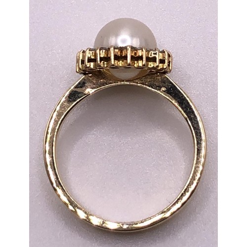 820 - A yellow coloured metal, cultured pearl and diamond chip cluster ring, ring size L