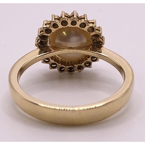 820 - A yellow coloured metal, cultured pearl and diamond chip cluster ring, ring size L