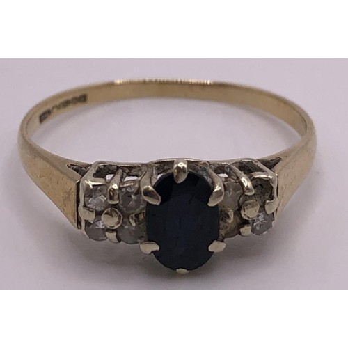 821 - A 9ct gold, sapphire and diamond ring,  ring size O