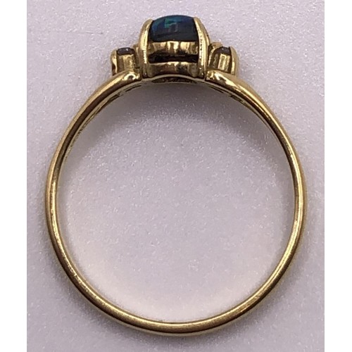 822 - An 18ct gold and opal ring, ring size L