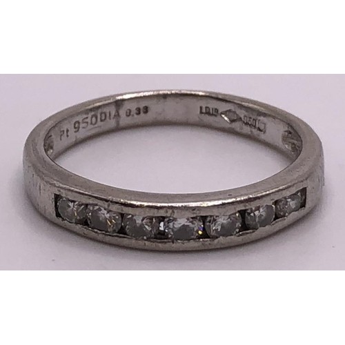 823 - An 18ct white gold, and diamond half eternity ring