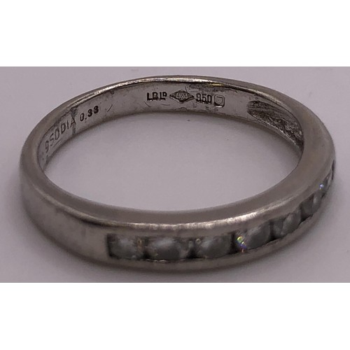 823 - An 18ct white gold, and diamond half eternity ring