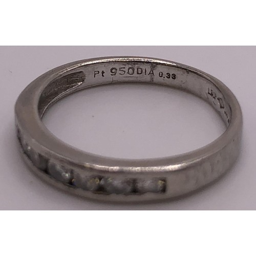 823 - An 18ct white gold, and diamond half eternity ring