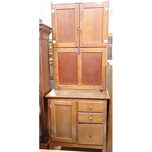 1338 - A mahogany bookcase, with two glazed doors, 160 cm high x 134 cm wide, and an oak pantry cupboard 74... 