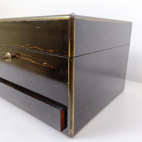 190 - A 19th century coromandel dressing box, the hinged top to reveal a mirror and various silver top bot... 