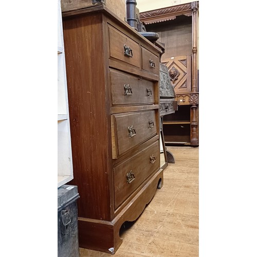 1322 - A walnut chest, having two short and three long drawers, 107 cm wide, a carved oak bureau, in need o... 