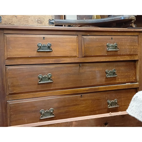 1322 - A walnut chest, having two short and three long drawers, 107 cm wide, a carved oak bureau, in need o... 