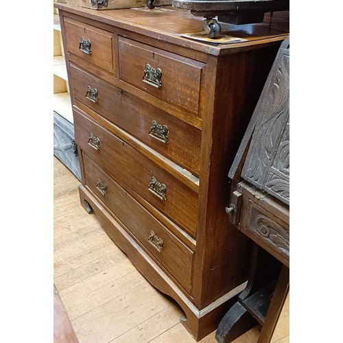 1322 - A walnut chest, having two short and three long drawers, 107 cm wide, a carved oak bureau, in need o... 