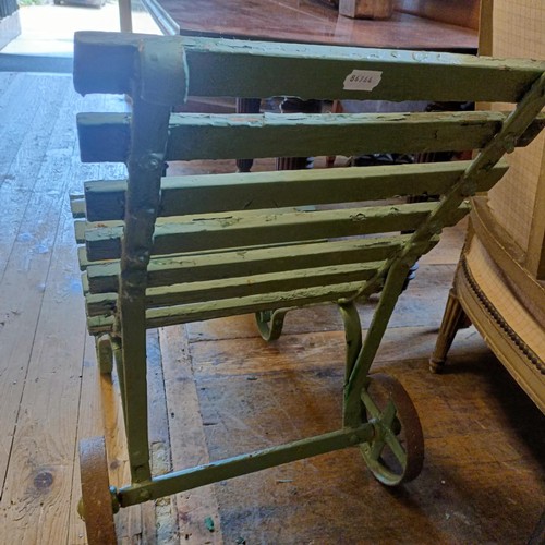 1279 - A pair of Country House green painted garden chairs, by Bacon & Curtis, Bournemouth, with metal ... 