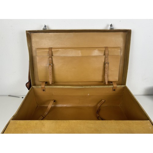 565 - A vintage fitted suitcase, fitted with silver topped bottles, in a canvas case