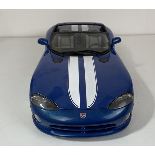 22 - An Anso 1:12 scale model of a Dodge Viper, boxed, another, boxed, and assorted loose model cars (box... 