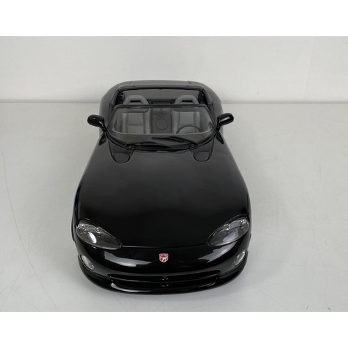 22 - An Anso 1:12 scale model of a Dodge Viper, boxed, another, boxed, and assorted loose model cars (box... 