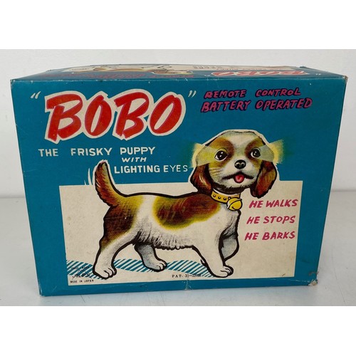 24 - A Bobo toy dog, boxed, and assorted other toys