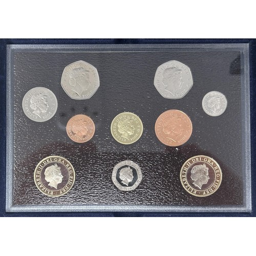 71 - A Royal Mint Executive Proof Coin set, 2004, and four silver proof £1 coins (both boxed)