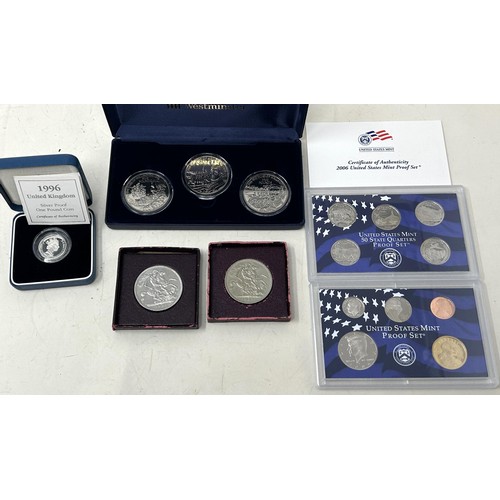 107 - Assorted commemorative crowns, and other coins, all boxed