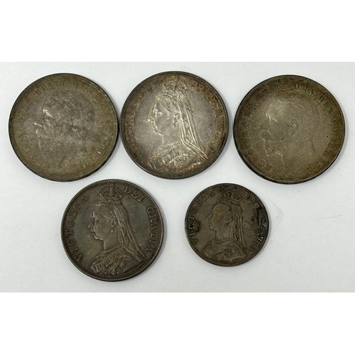 118 - A crown, 1887, two others, 1935, a double florin, 1887, and a florin, previously mounted as a brooch... 