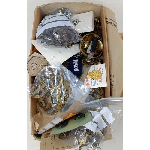 253 - A large group of assorted military badges, buttons and other items (box)