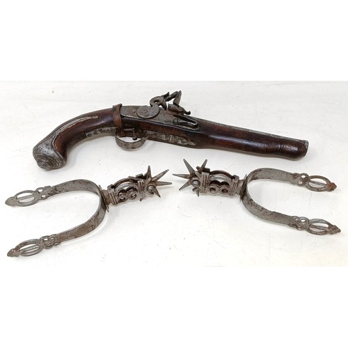 255 - A pair of 16th century style spurs, and a flintlock style pistol