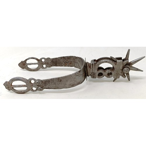 255 - A pair of 16th century style spurs, and a flintlock style pistol