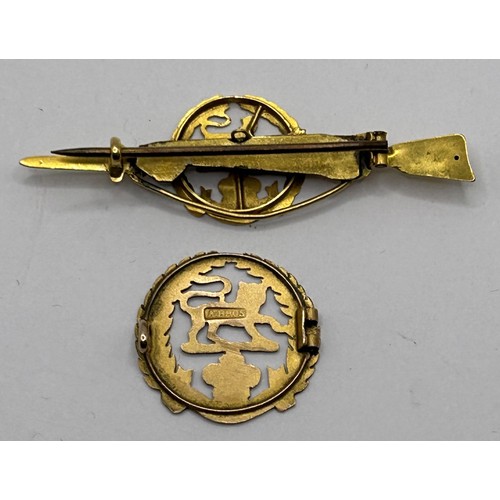 289 - A Hampshire Regiment sweetheart brooch, another similar, lacks its pin, and a Garrard jewellery box