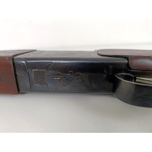 307 - A Russian 12 bore over and under double barrel shotgun, stamped Made In USSRNote: This can only be r... 