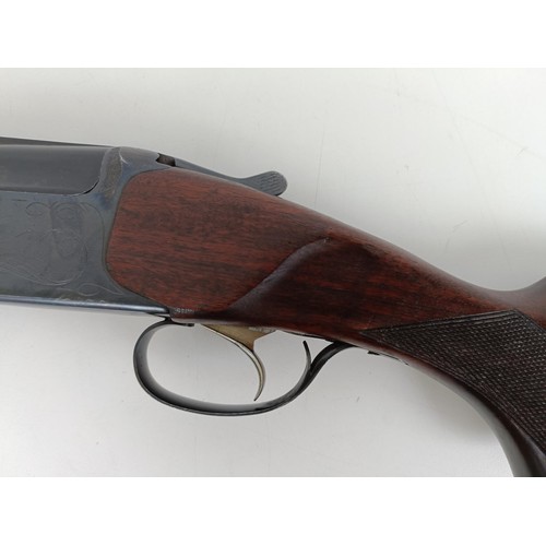 307 - A Russian 12 bore over and under double barrel shotgun, stamped Made In USSRNote: This can only be r... 