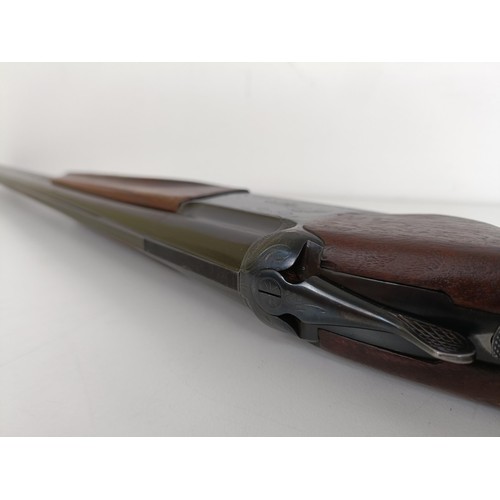 307 - A Russian 12 bore over and under double barrel shotgun, stamped Made In USSRNote: This can only be r... 