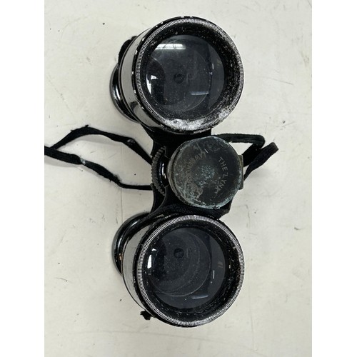 288 - A monocular, and a pair of small field glasses, in a leather case, the inside stamped Lawrence &... 