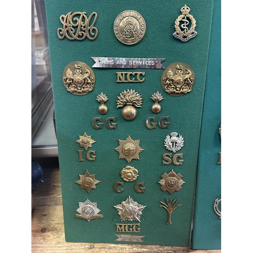 305 - A collection of assorted badges and shoulder titles, including the Tank Regiment and Machine Gun Cor... 