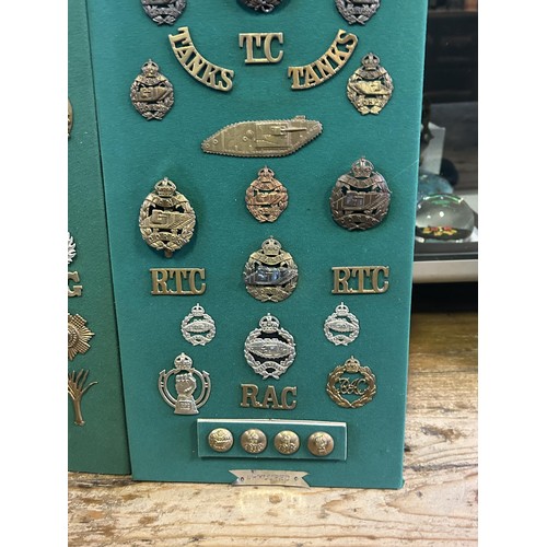 305 - A collection of assorted badges and shoulder titles, including the Tank Regiment and Machine Gun Cor... 